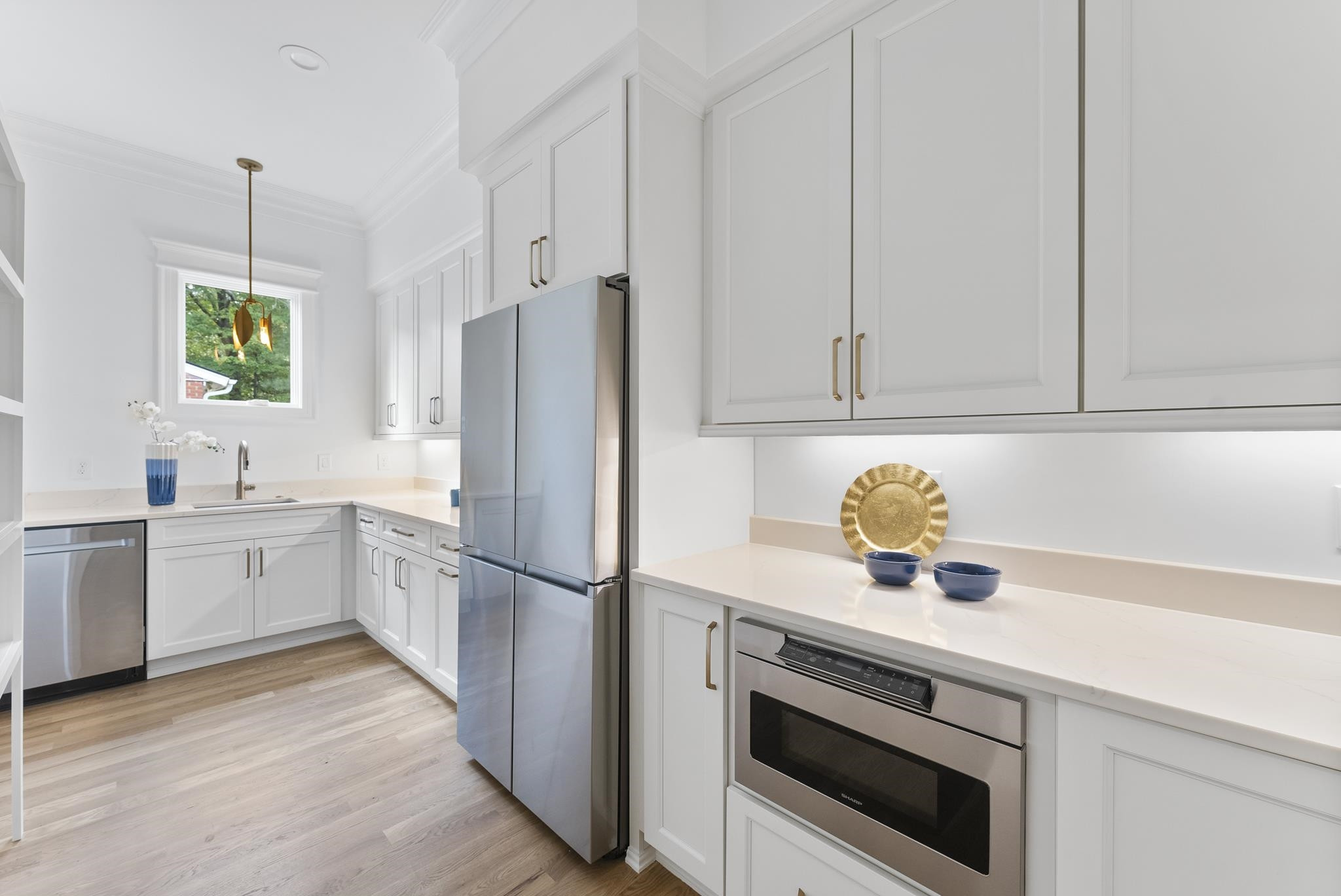 1419 Chester Road Raleigh, NC 27608 - Photo 11 of 41 a kitchen with a sink appliances and cabinets