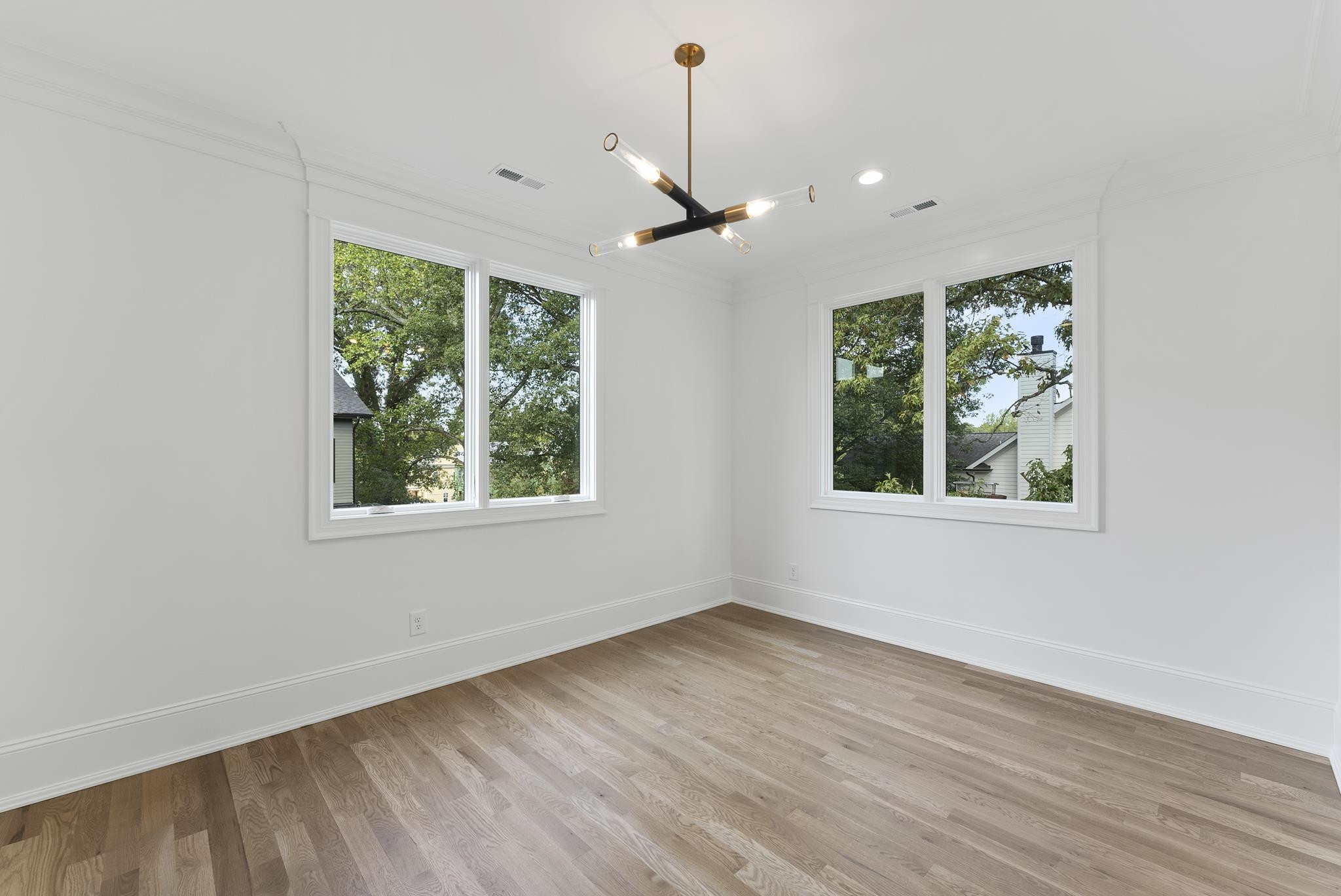 1419 Chester Road Raleigh, NC 27608 - Photo 35 of 41 a view of an empty room with wooden floor and a window