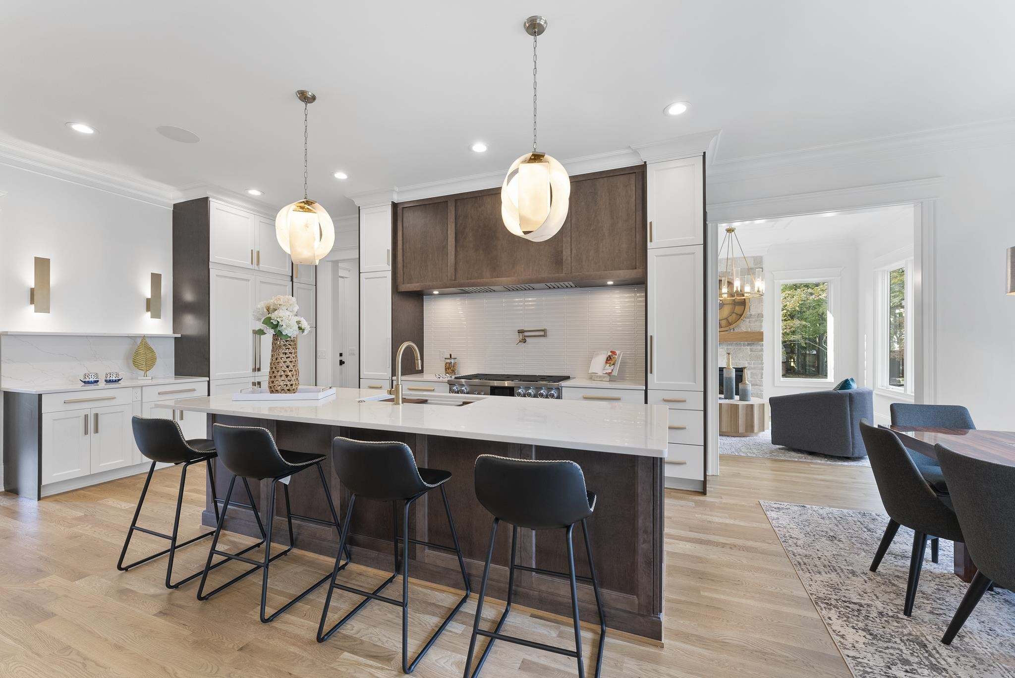 1419 Chester Road Raleigh, NC 27608 - Photo 5 of 41 a kitchen with a dining table chairs sink and wooden floor