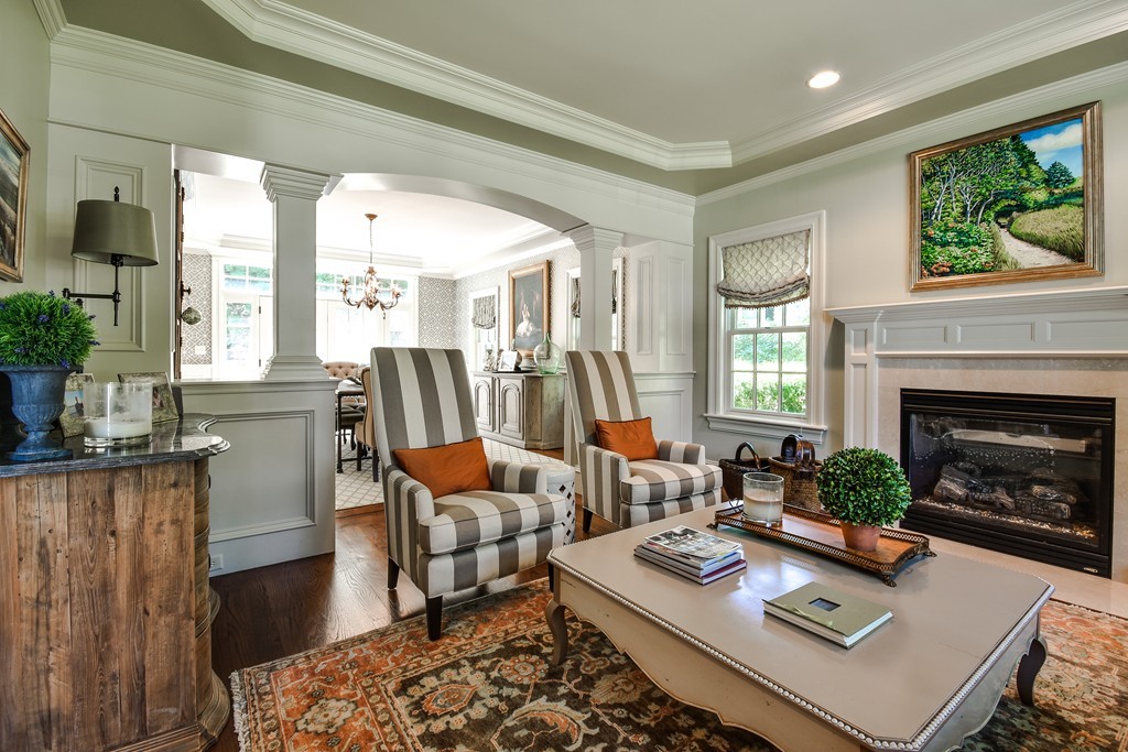 39 Sheridan Road Wellesley, MA 02481 - Photo 3 of 18 a living room with furniture and a fireplace