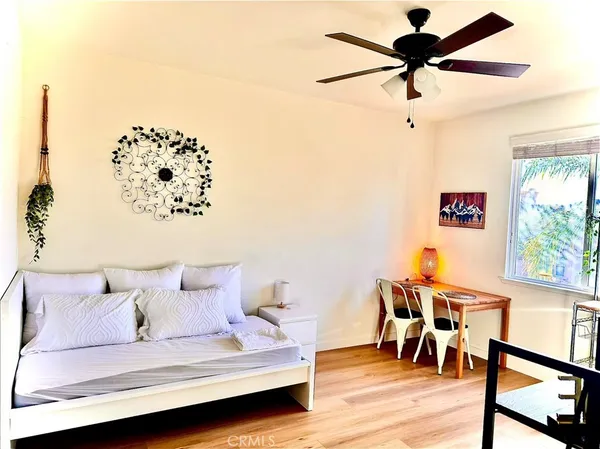 a bedroom with a bed and a dresser