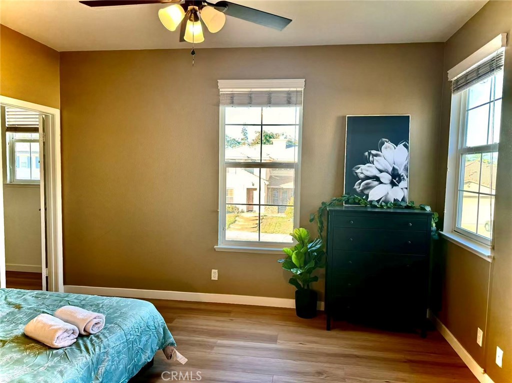 6805 Edinburgh Road Eastvale, CA 92880 - Photo 14 of 47 a bedroom with a bed and a window