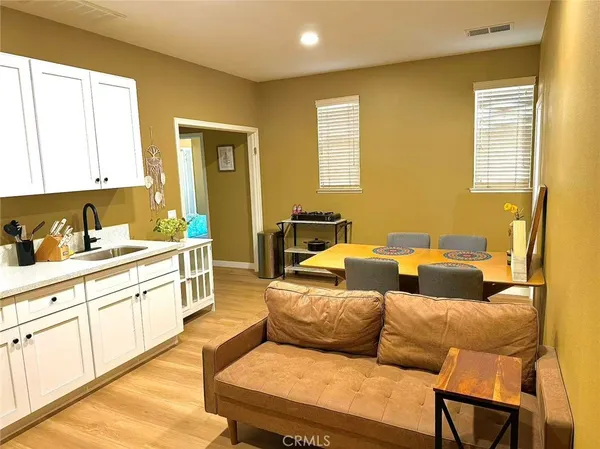 a kitchen with a sink appliances and cabinets
