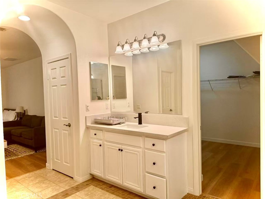 6805 Edinburgh Road Eastvale, CA 92880 - Photo 23 of 47 a spacious bathroom with a double vanity sink mirror and shower