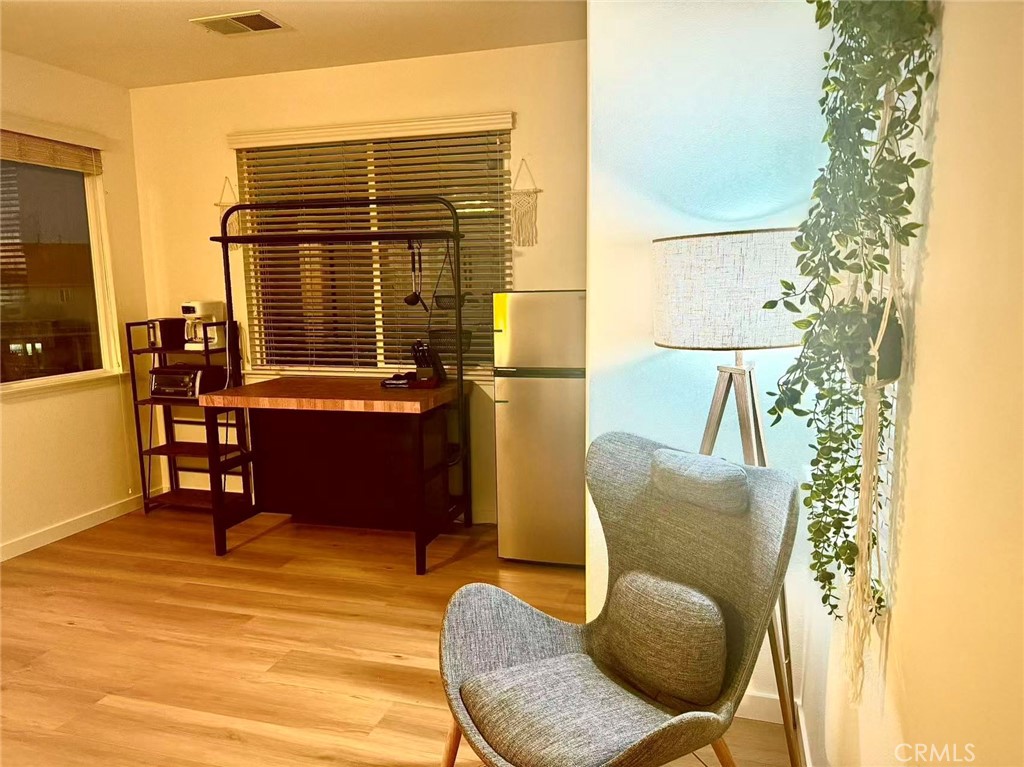 6805 Edinburgh Road Eastvale, CA 92880 - Photo 24 of 47 a balcony with furniture and a potted plant