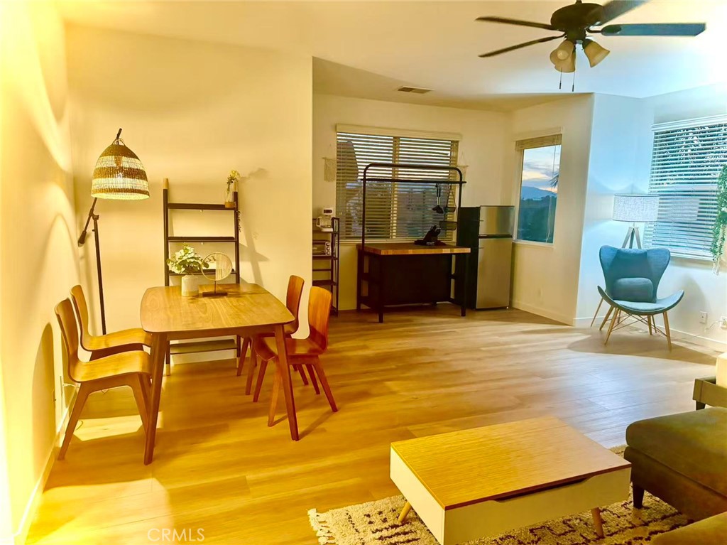 6805 Edinburgh Road Eastvale, CA 92880 - Photo 26 of 47 a living room with furniture and a wooden floor