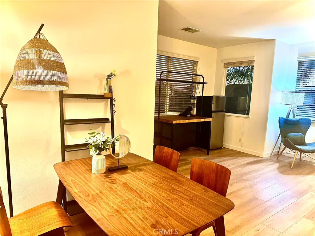6805 Edinburgh Road Eastvale, CA 92880 - Photo 27 of 47 a view of a dining room with furniture