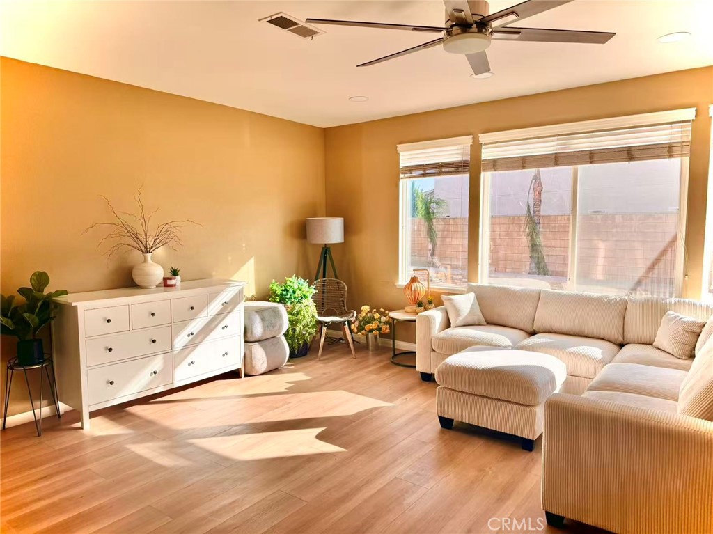 6805 Edinburgh Road Eastvale, CA 92880 - Photo 36 of 47 a bedroom with furniture and a large window