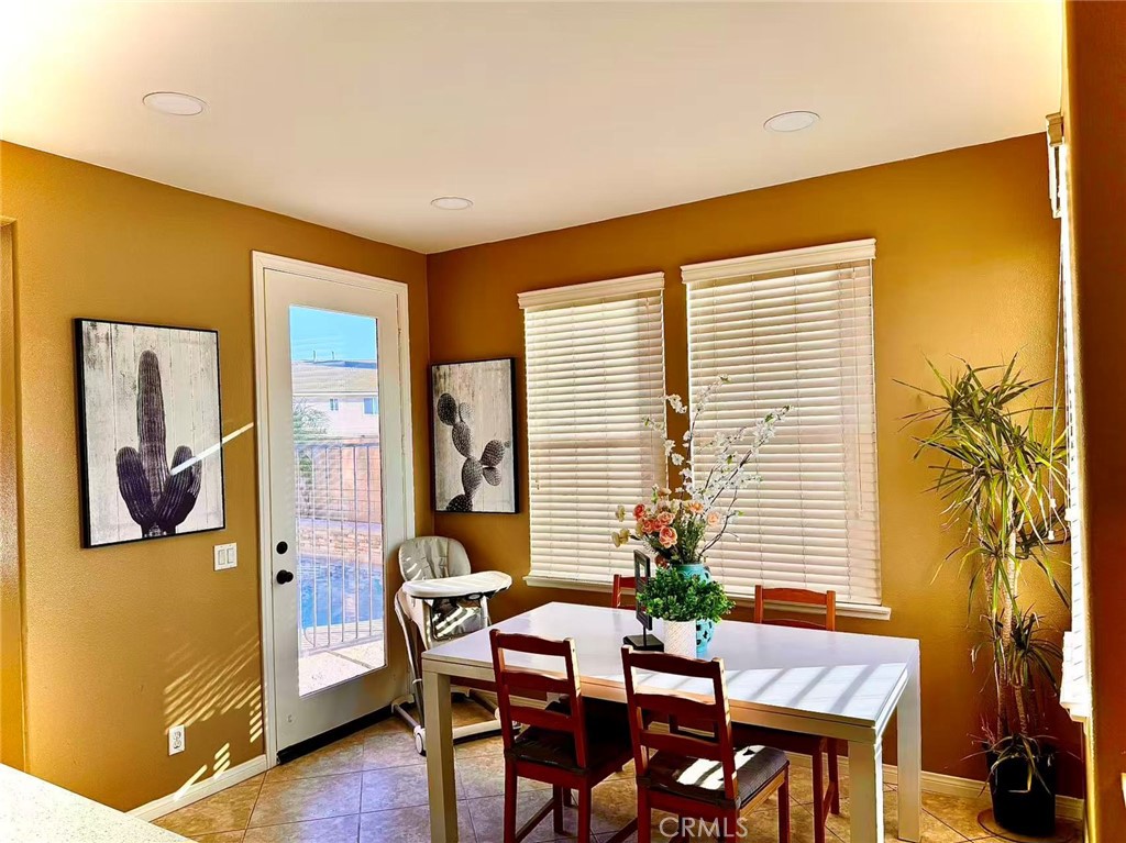6805 Edinburgh Road Eastvale, CA 92880 - Photo 38 of 47 a view of a livingroom with furniture and window