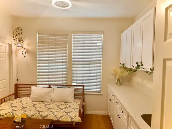 a bedroom with cabinets and bed