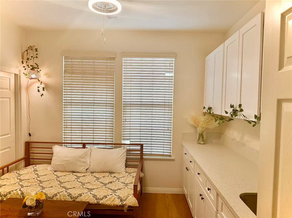 6805 Edinburgh Road Eastvale, CA 92880 - Photo 45 of 47 a bedroom with a bed and a window