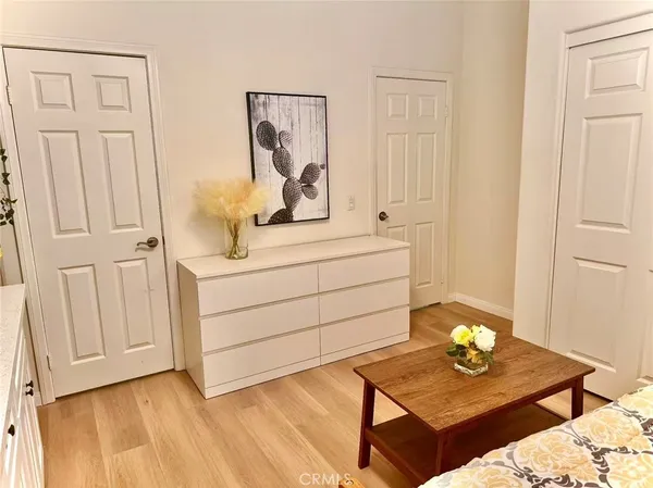 a bedroom with cabinets and bed