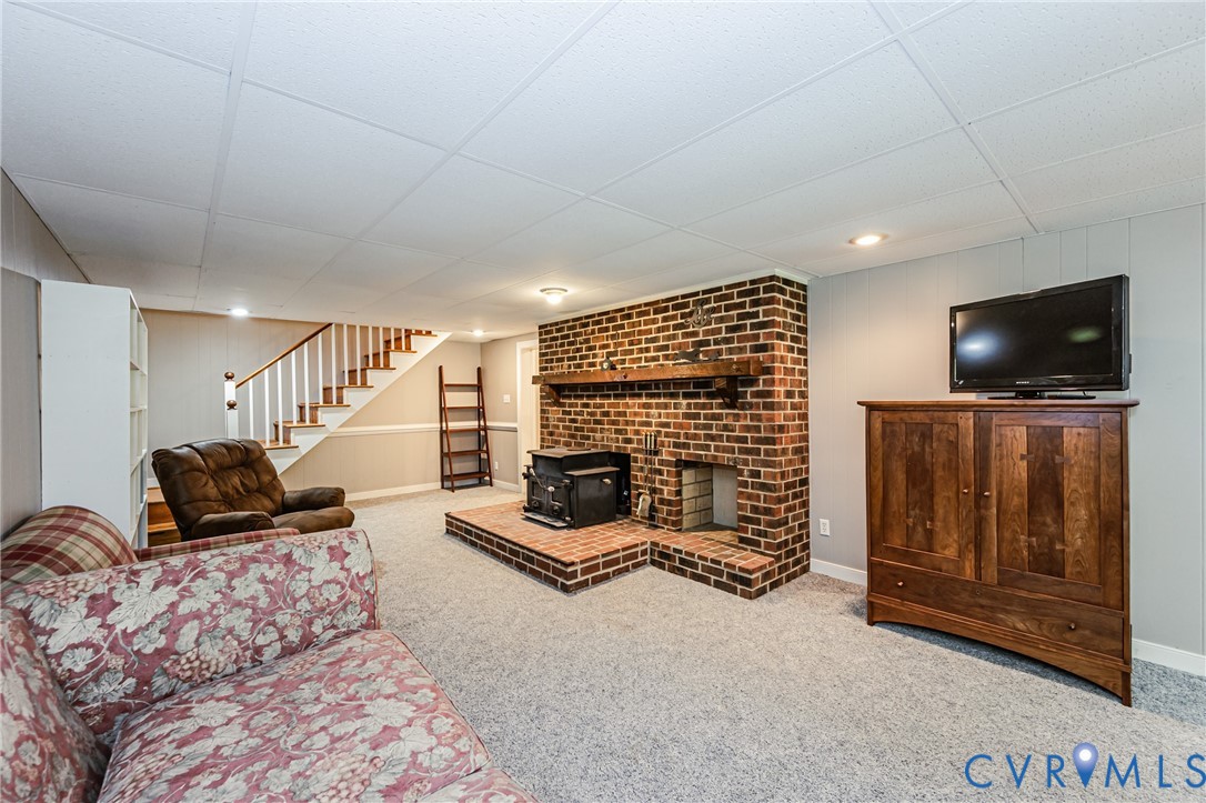 15611 Robert Terrell Road Montpelier, VA 23192 - Photo 12 of 28 Spacious room featuring a prominent brick fireplac