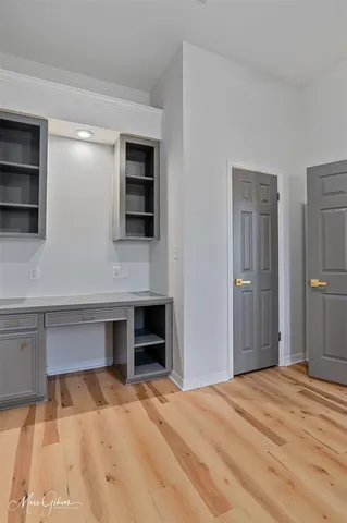 a bedroom with a bed and a television