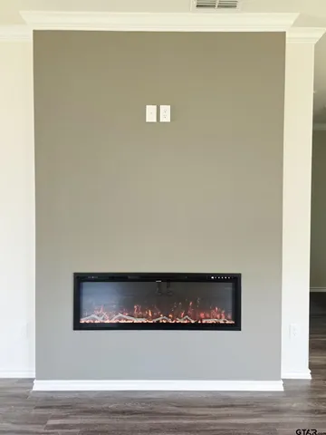 a view of a living room with a wooden floor