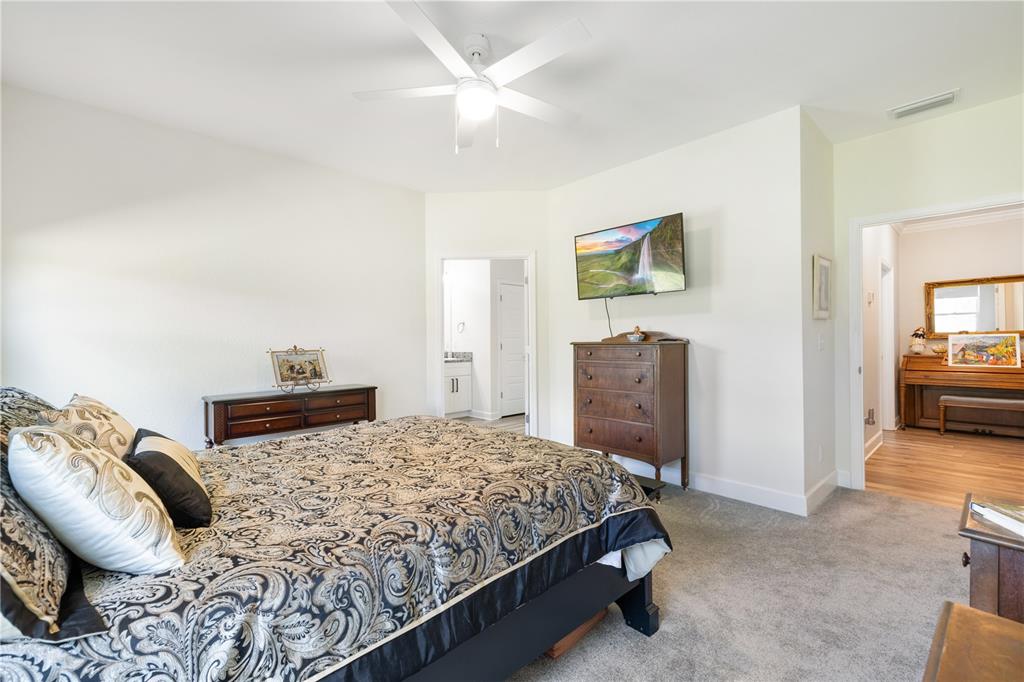 5149 Southwest 119th Road Lake Butler, FL 32054 - Photo 22 of 40 a bedroom with a bed and a couch