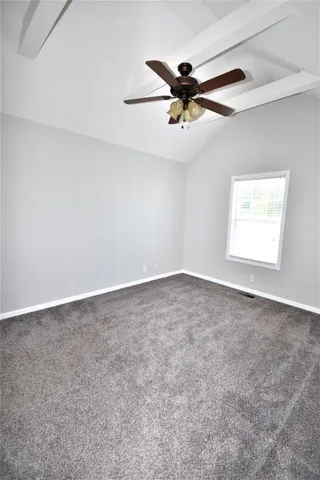 an empty room with a empty space and windows