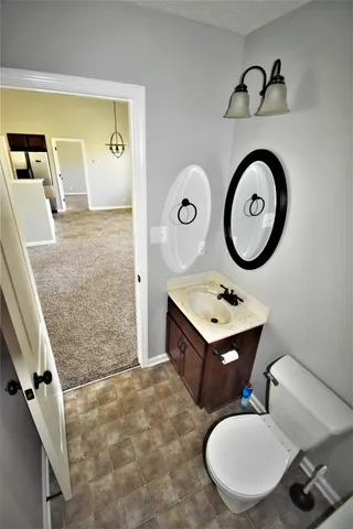 a view of a room with a window and a ceiling fan