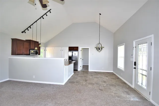 a view interior of a house wooden floor windows and entryway