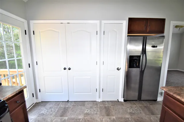 a view of empty room with a fireplace