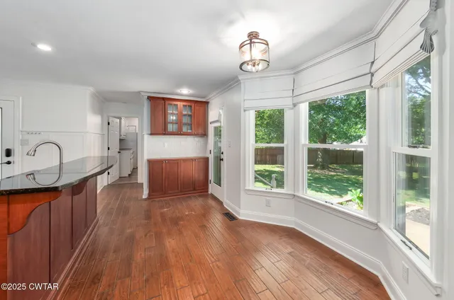a view of a large kitchen with a large window