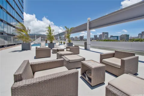 a view of swimming pool with outdoor seating