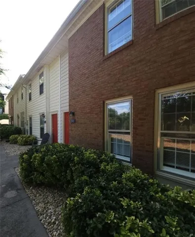 a view of a brick house with windows