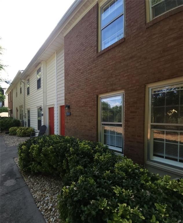 a view of a brick house with windows