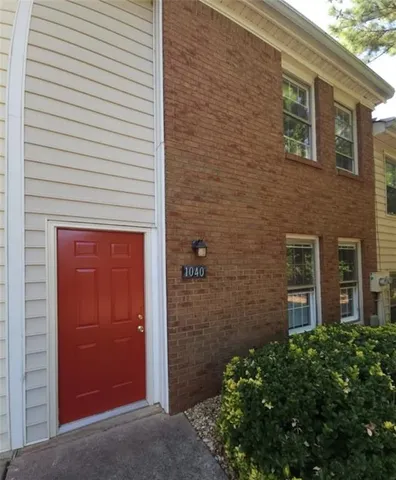 a view of a brick house with a small space