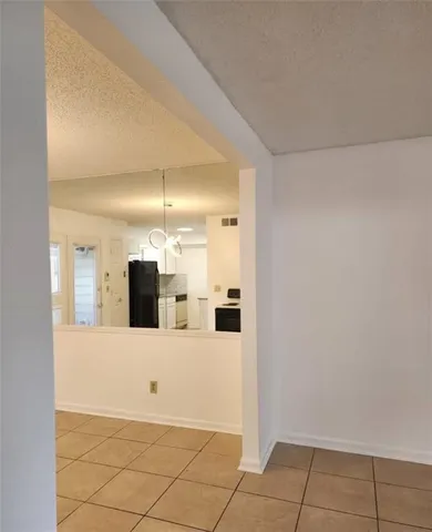 a view of a kitchen cabinets and microwave