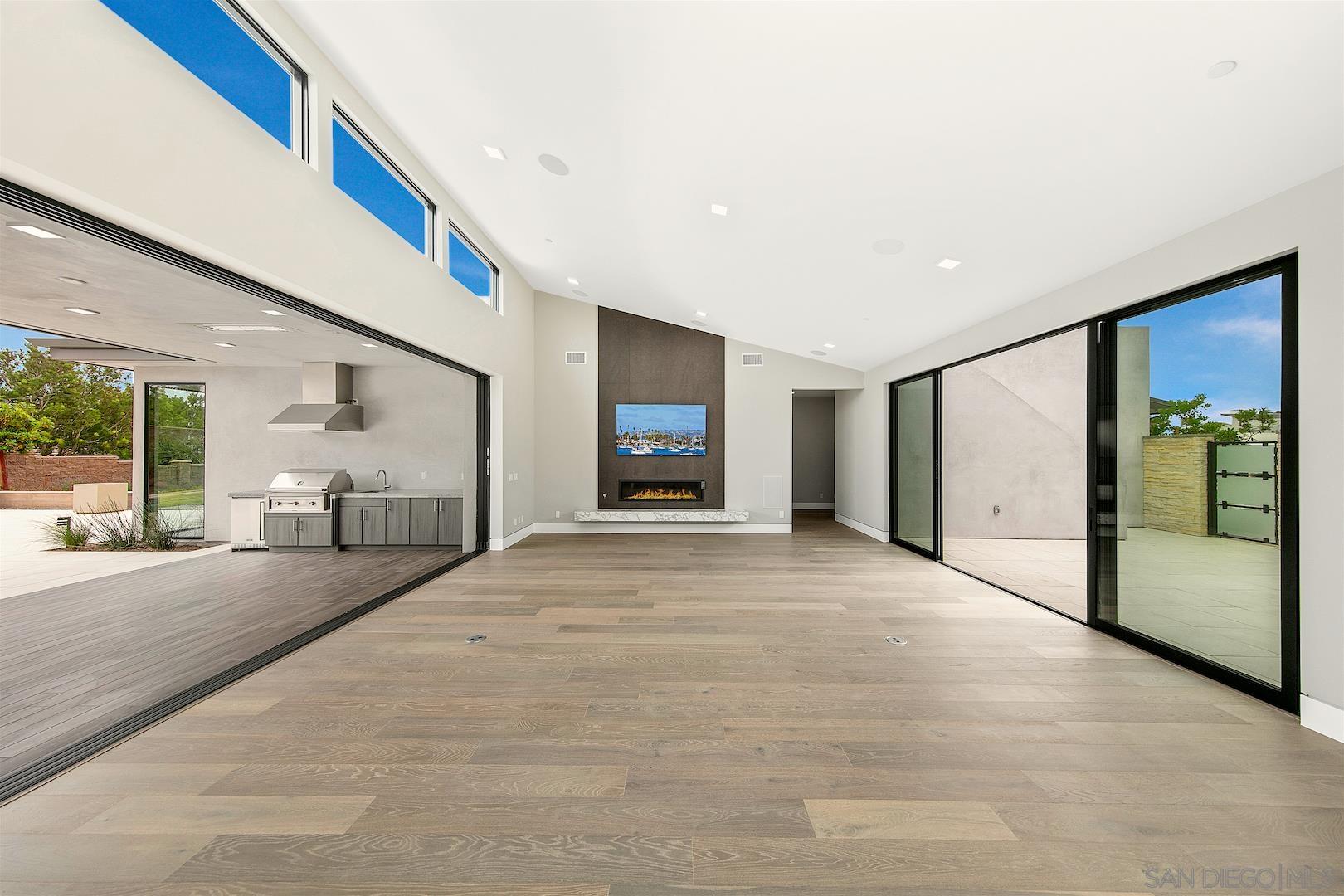 1817 Gwynn Drive Cardiff, CA 92007 - Photo 19 of 50 a spacious bedroom with a large bed and a large window