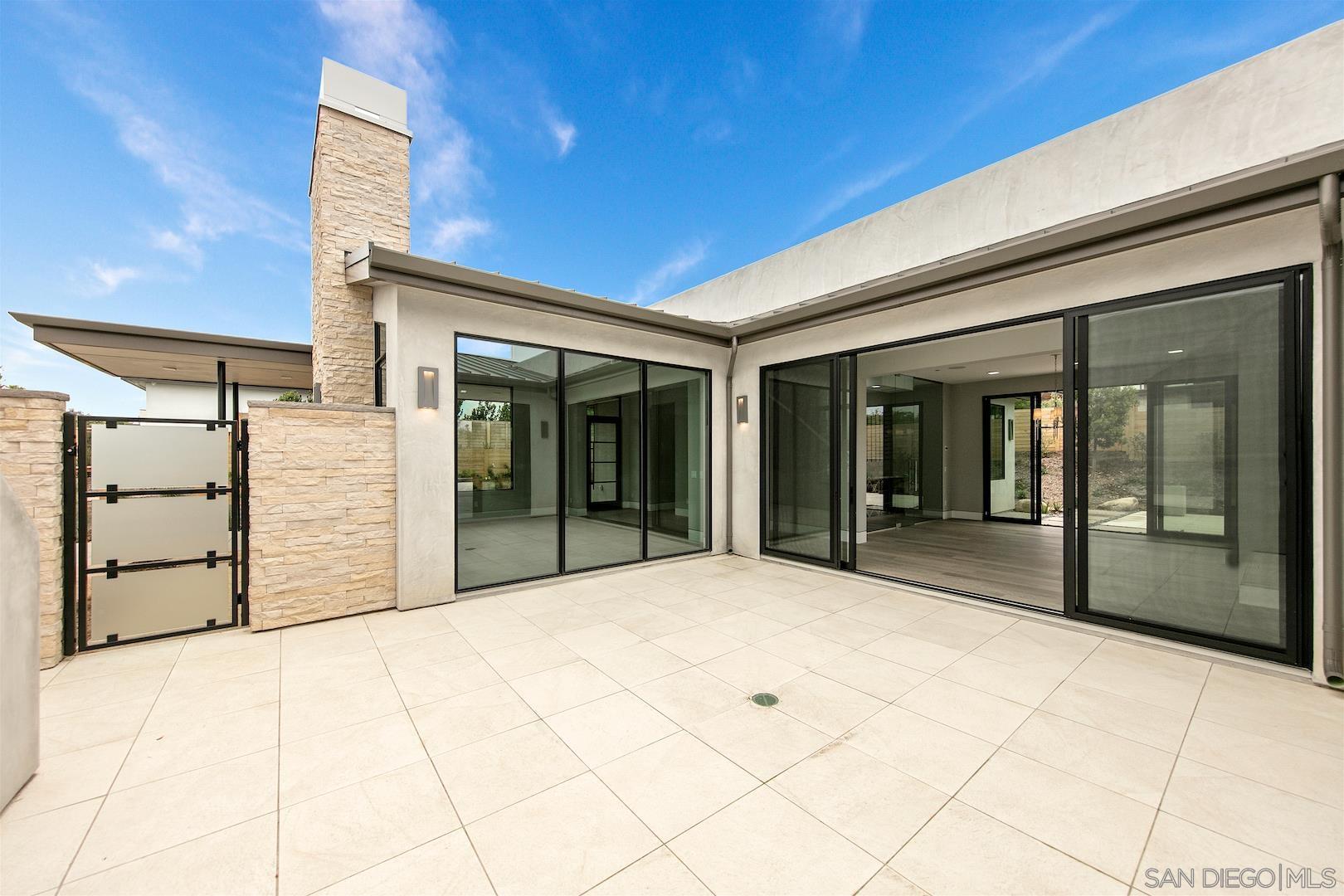1817 Gwynn Drive Cardiff, CA 92007 - Photo 20 of 50 a view of a brick house with a large window