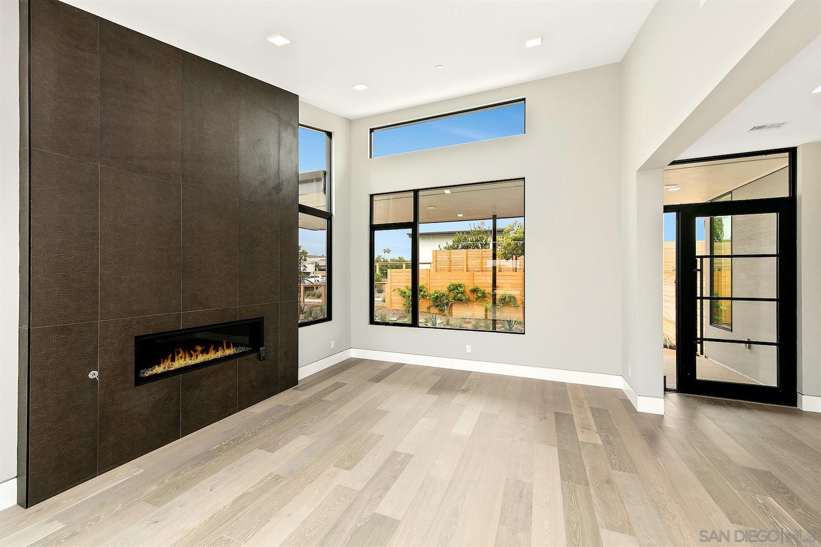 1817 Gwynn Drive Cardiff, CA 92007 - Photo 29 of 50 a view of an empty room with a fireplace and a window