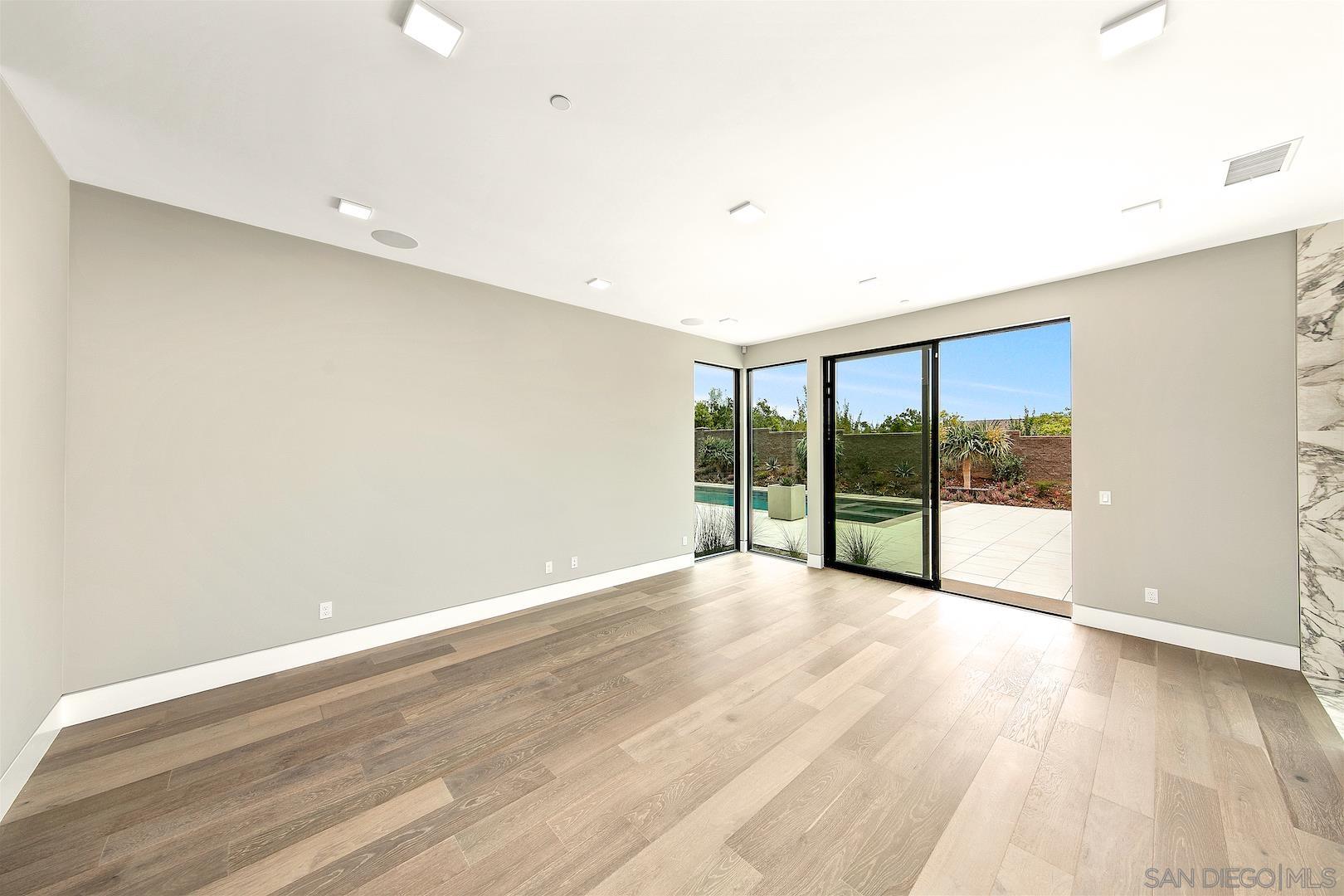 1817 Gwynn Drive Cardiff, CA 92007 - Photo 31 of 50 a view of an empty room with wooden floor and a window
