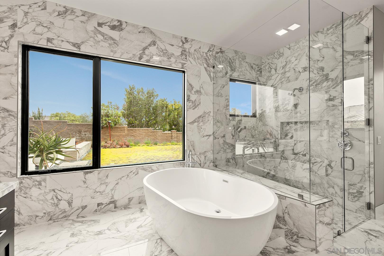 1817 Gwynn Drive Cardiff, CA 92007 - Photo 33 of 50 a white bath tub sitting next to a window