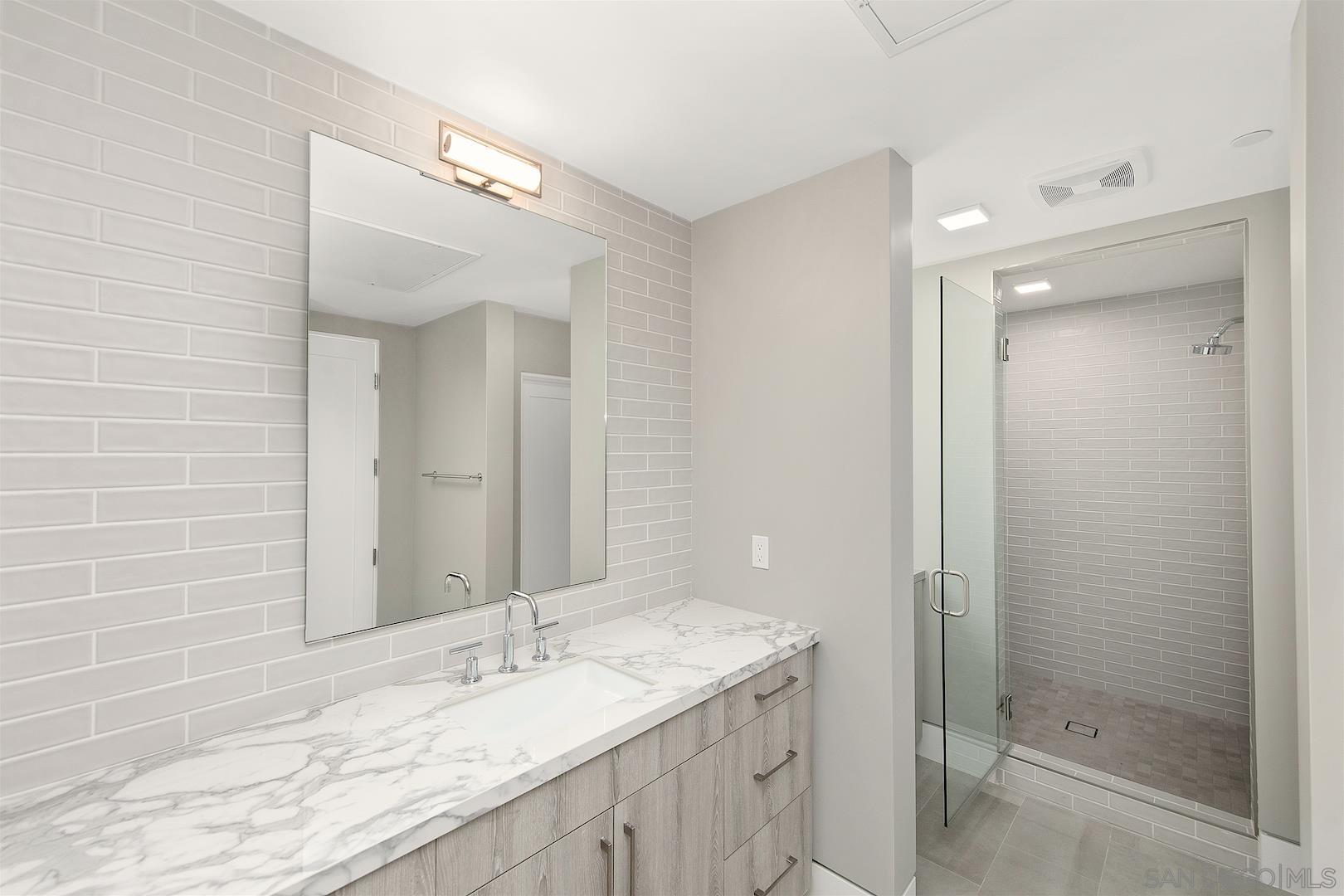 1817 Gwynn Drive Cardiff, CA 92007 - Photo 38 of 50 a bathroom with a granite countertop sink mirror and double