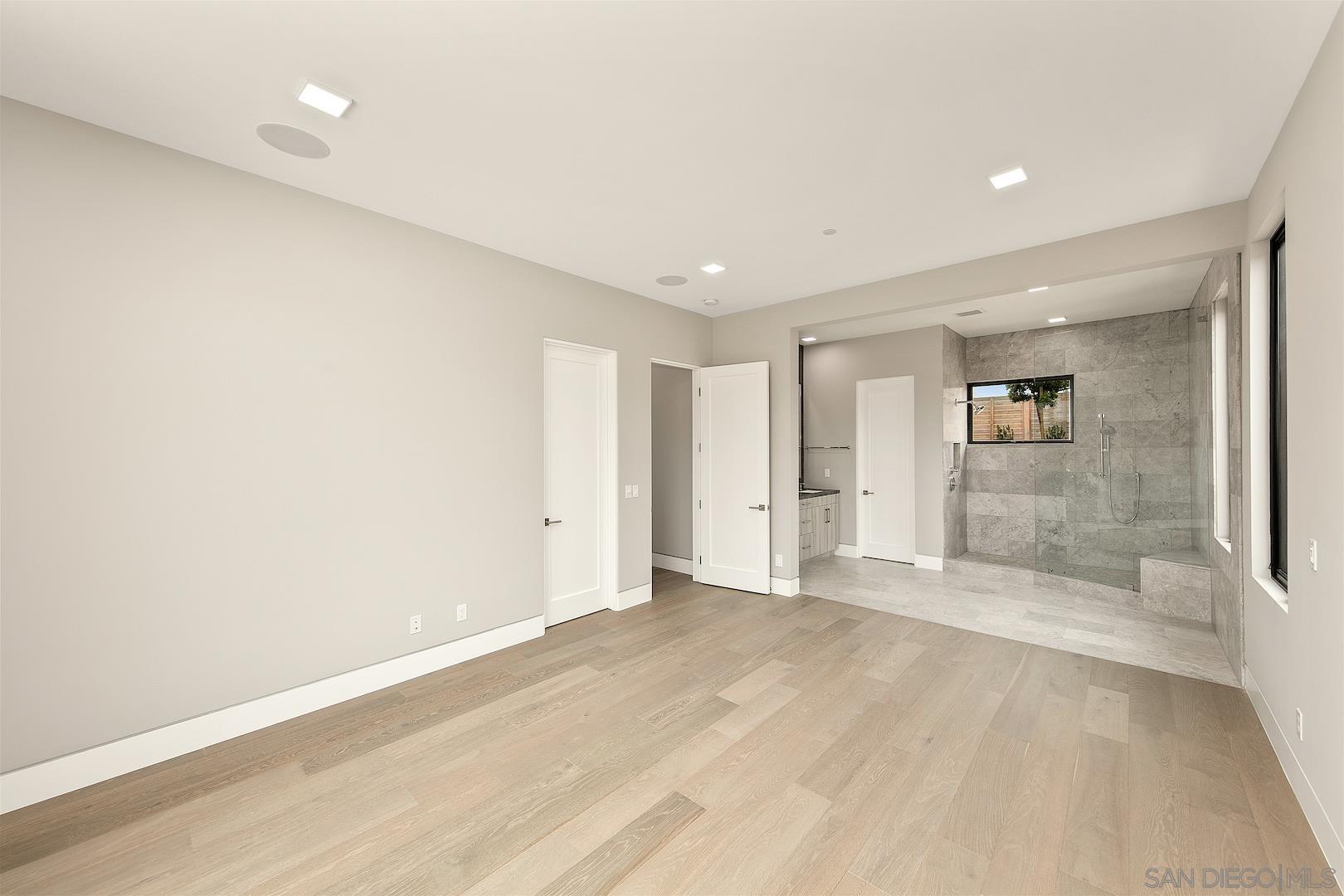 1817 Gwynn Drive Cardiff, CA 92007 - Photo 39 of 50 wooden floor in an empty room with a window