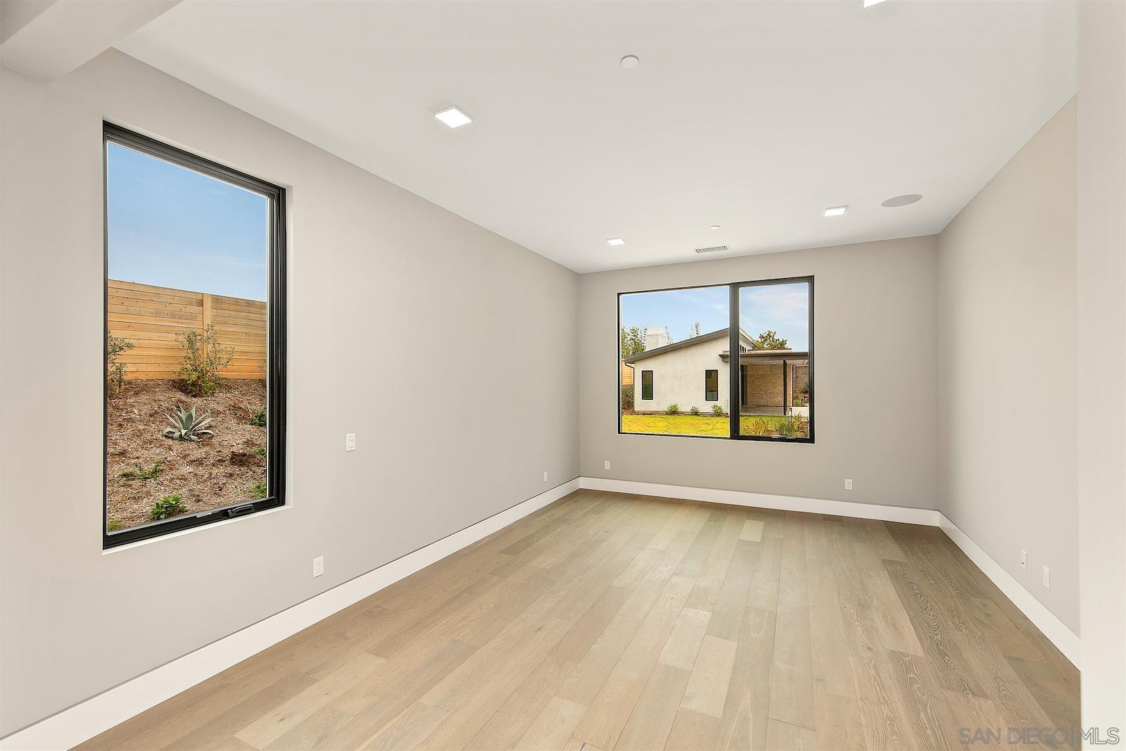 1817 Gwynn Drive Cardiff, CA 92007 - Photo 44 of 50 wooden floor in an empty room with a window