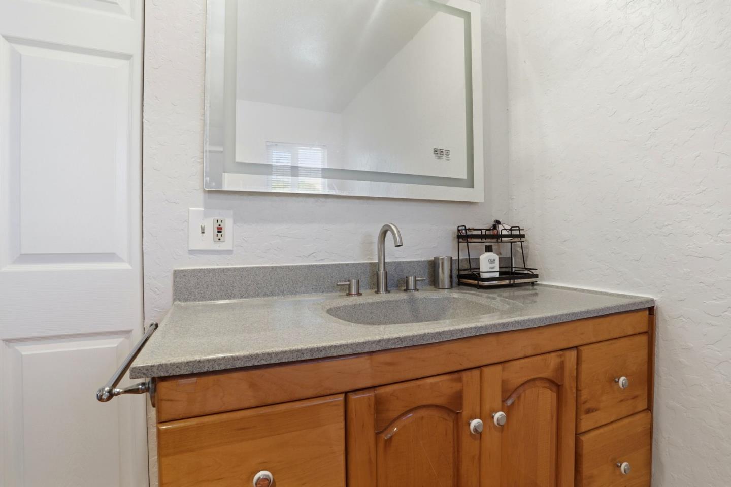 2594 San Juan Road Aromas, CA 95004 - Photo 15 of 34 a bathroom with a sink and a mirror