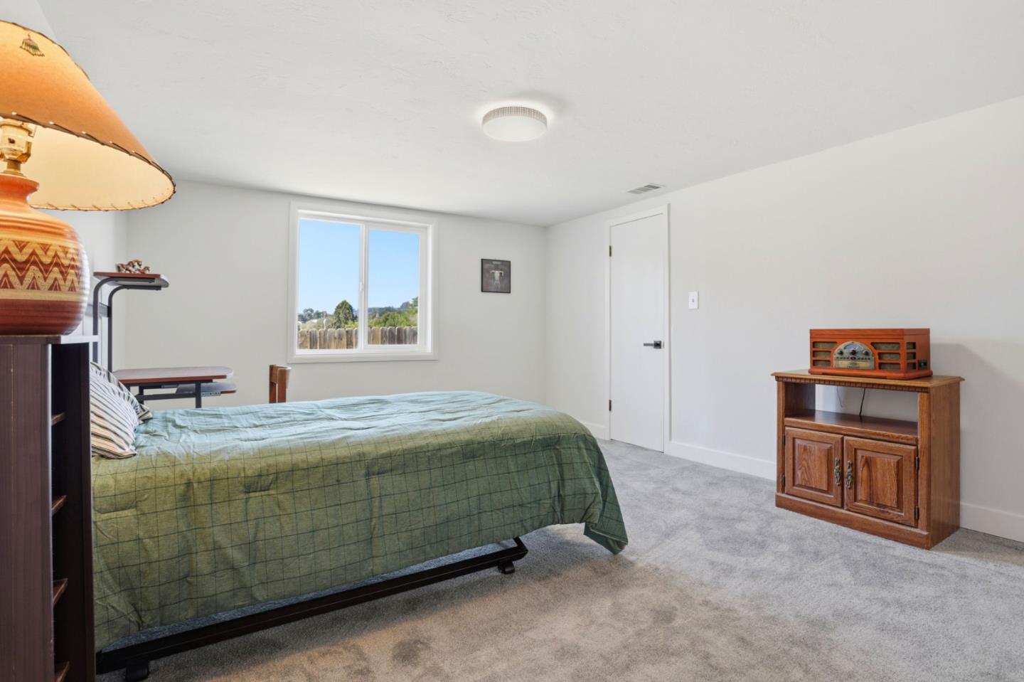 2594 San Juan Road Aromas, CA 95004 - Photo 16 of 34 a bedroom with a bed and a cabinets