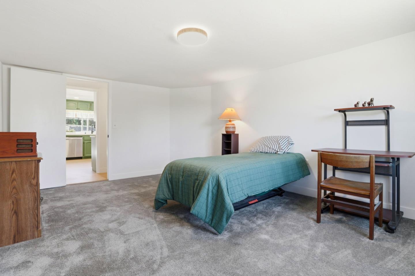 2594 San Juan Road Aromas, CA 95004 - Photo 17 of 34 a bedroom with a bed and a desk