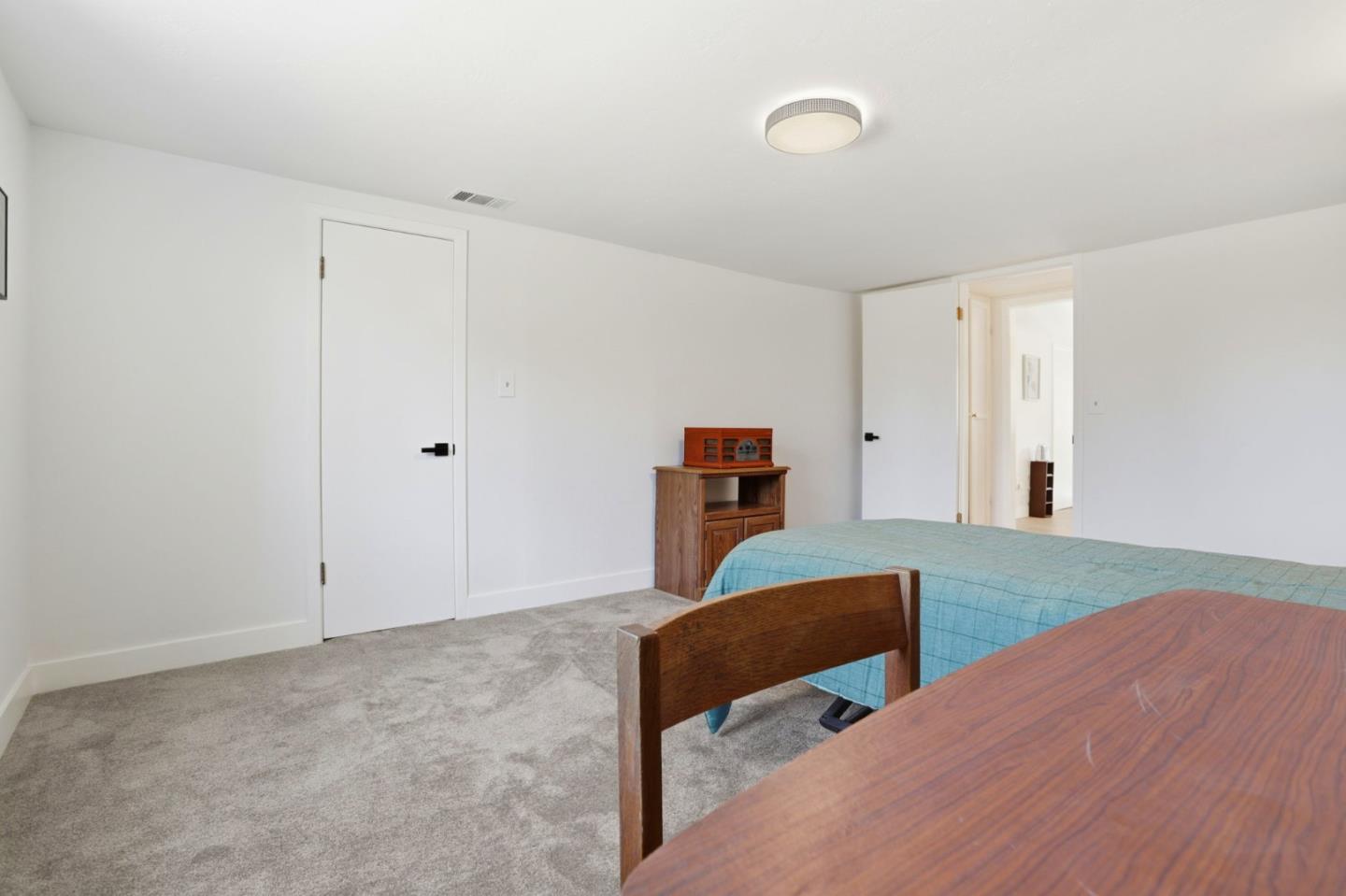 2594 San Juan Road Aromas, CA 95004 - Photo 18 of 34 a bedroom with furniture and a table