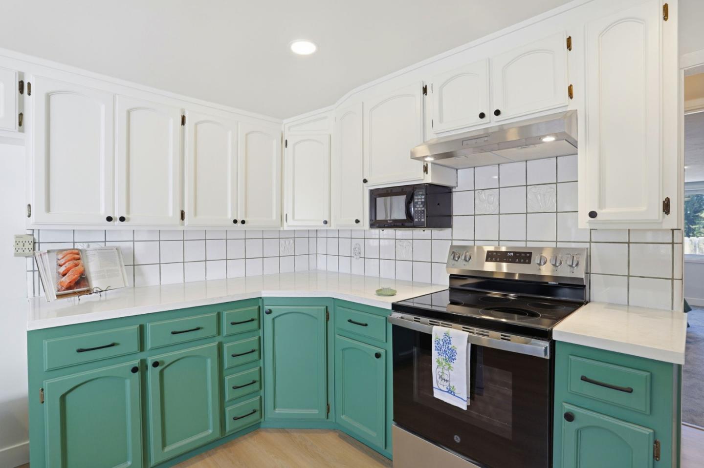 2594 San Juan Road Aromas, CA 95004 - Photo 8 of 34 a kitchen with cabinets a stove and a microwave