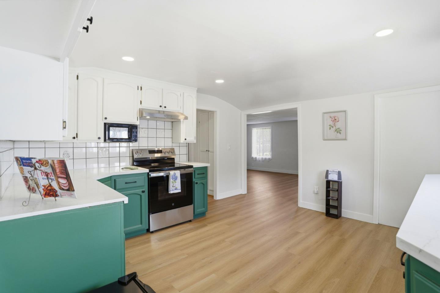 2594 San Juan Road Aromas, CA 95004 - Photo 9 of 34 a kitchen with cabinets and wooden floor