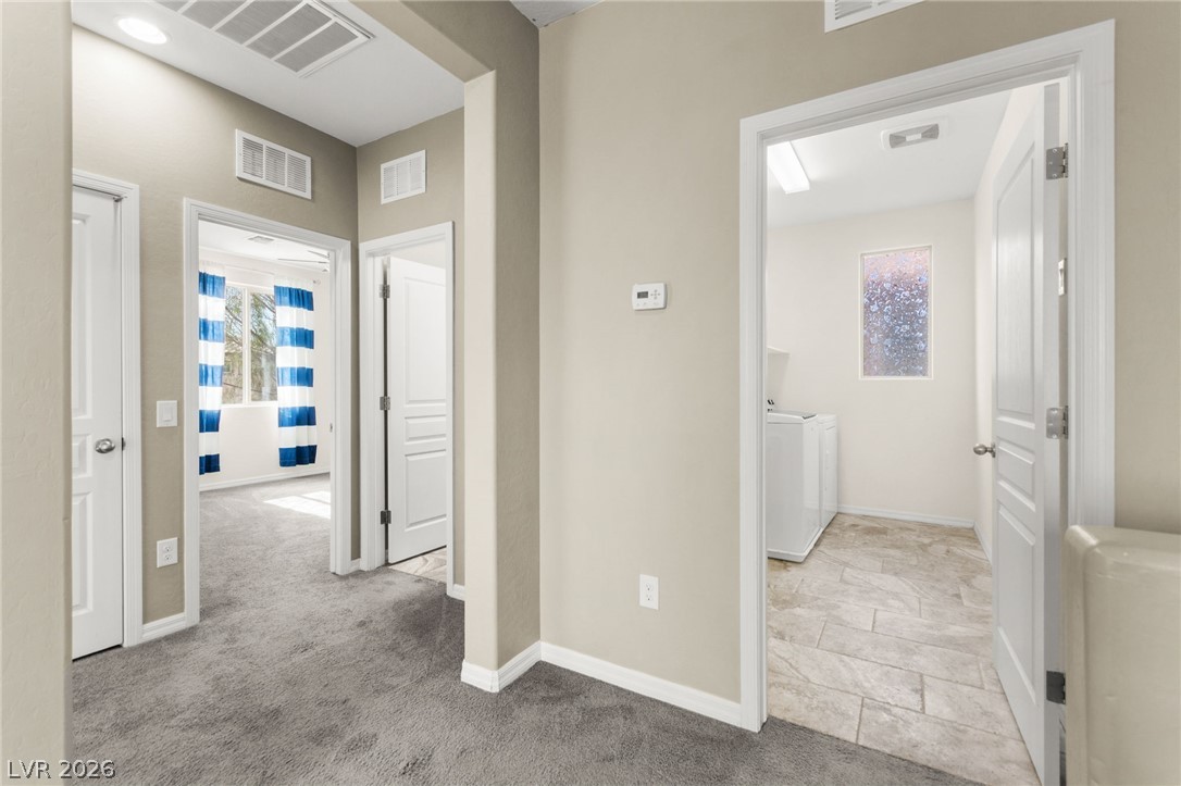 11048 Prairie Grove Road Las Vegas, NV 89179 - Photo 49 of 75 A centrally located utility space provides ease of access for laundry needs.