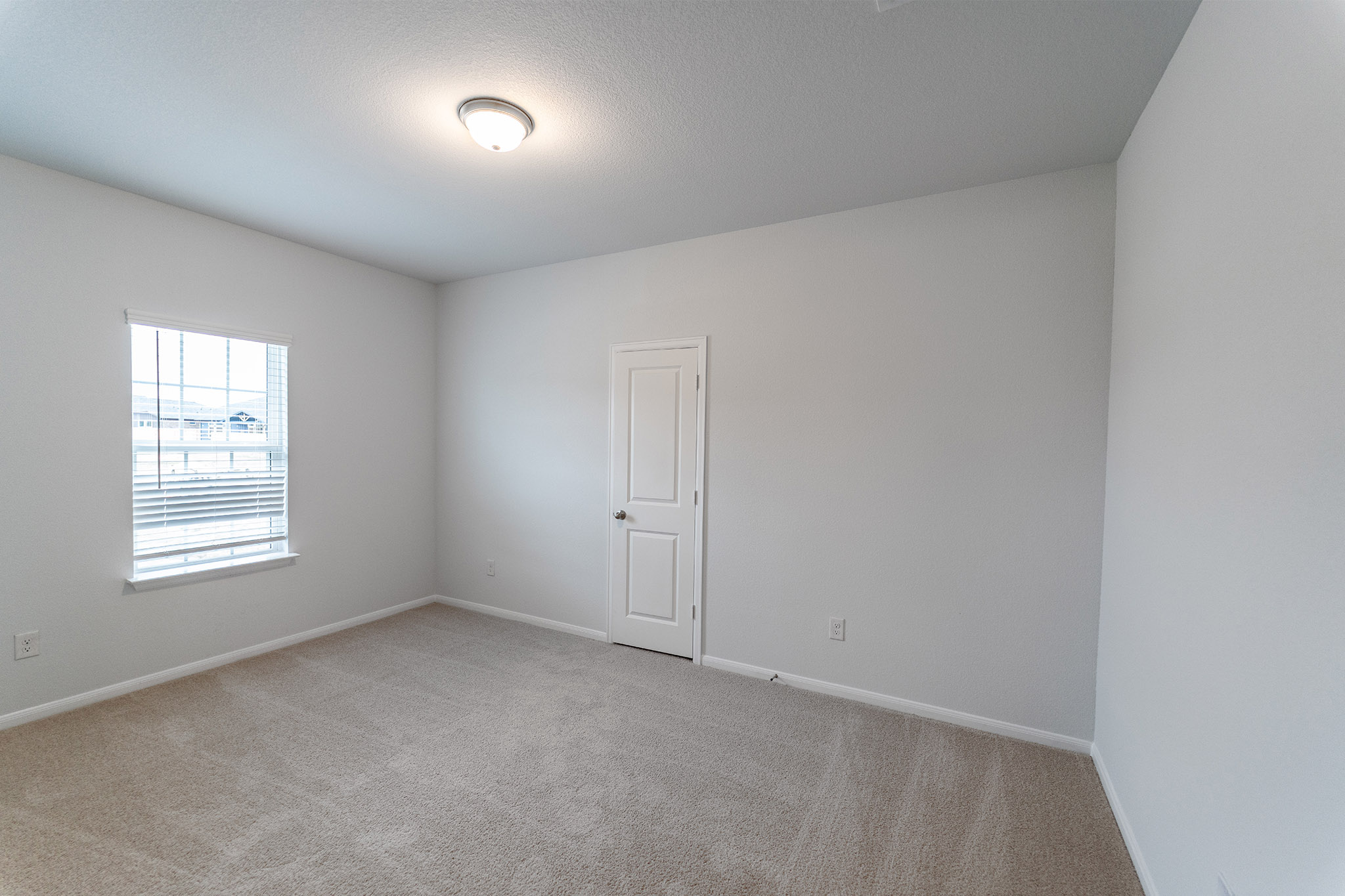 161 Mango Circle Buda, TX 78610 - Photo 9 of 22 an empty room with a window