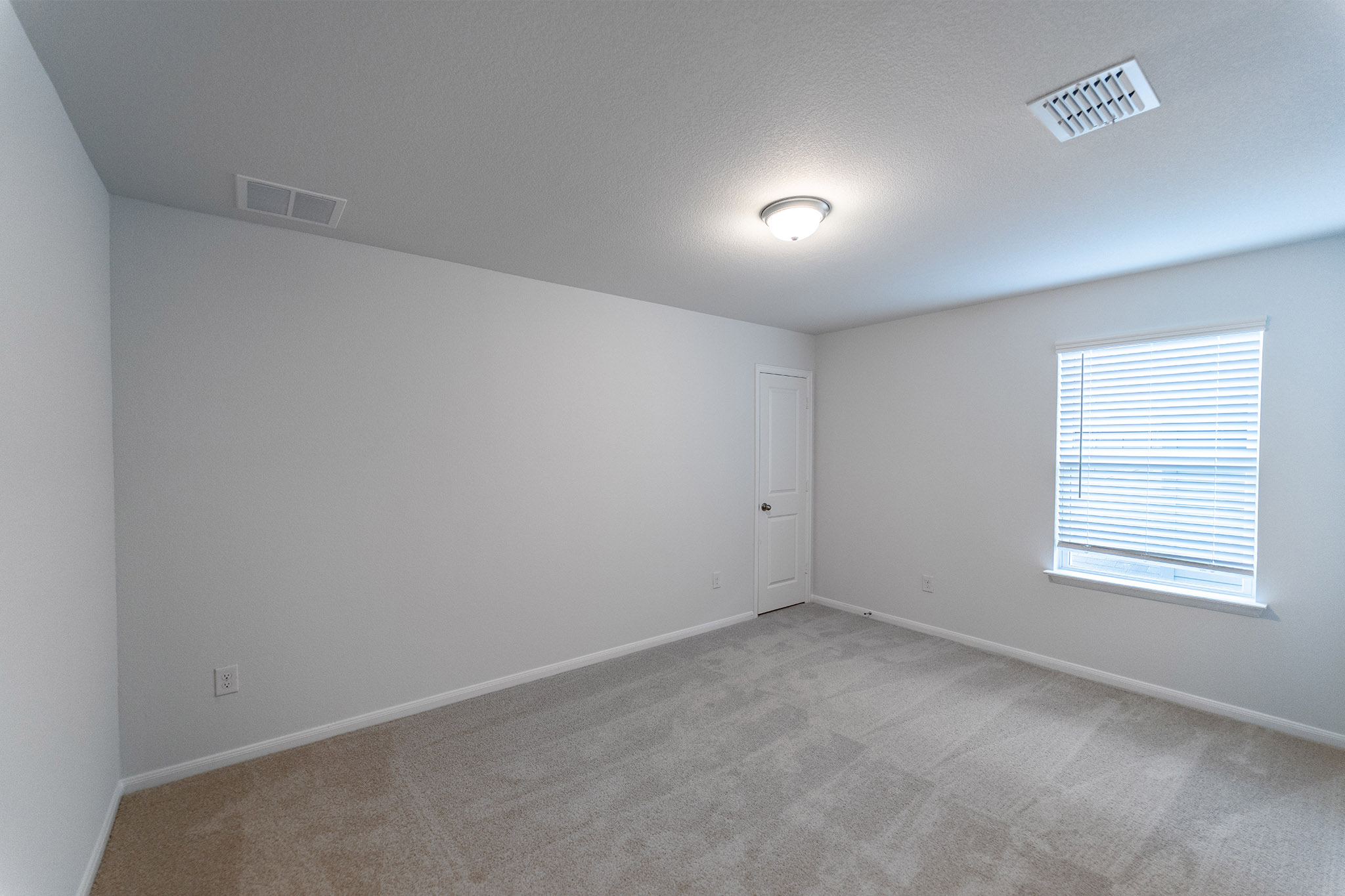 161 Mango Circle Buda, TX 78610 - Photo 12 of 22 an empty room with a window