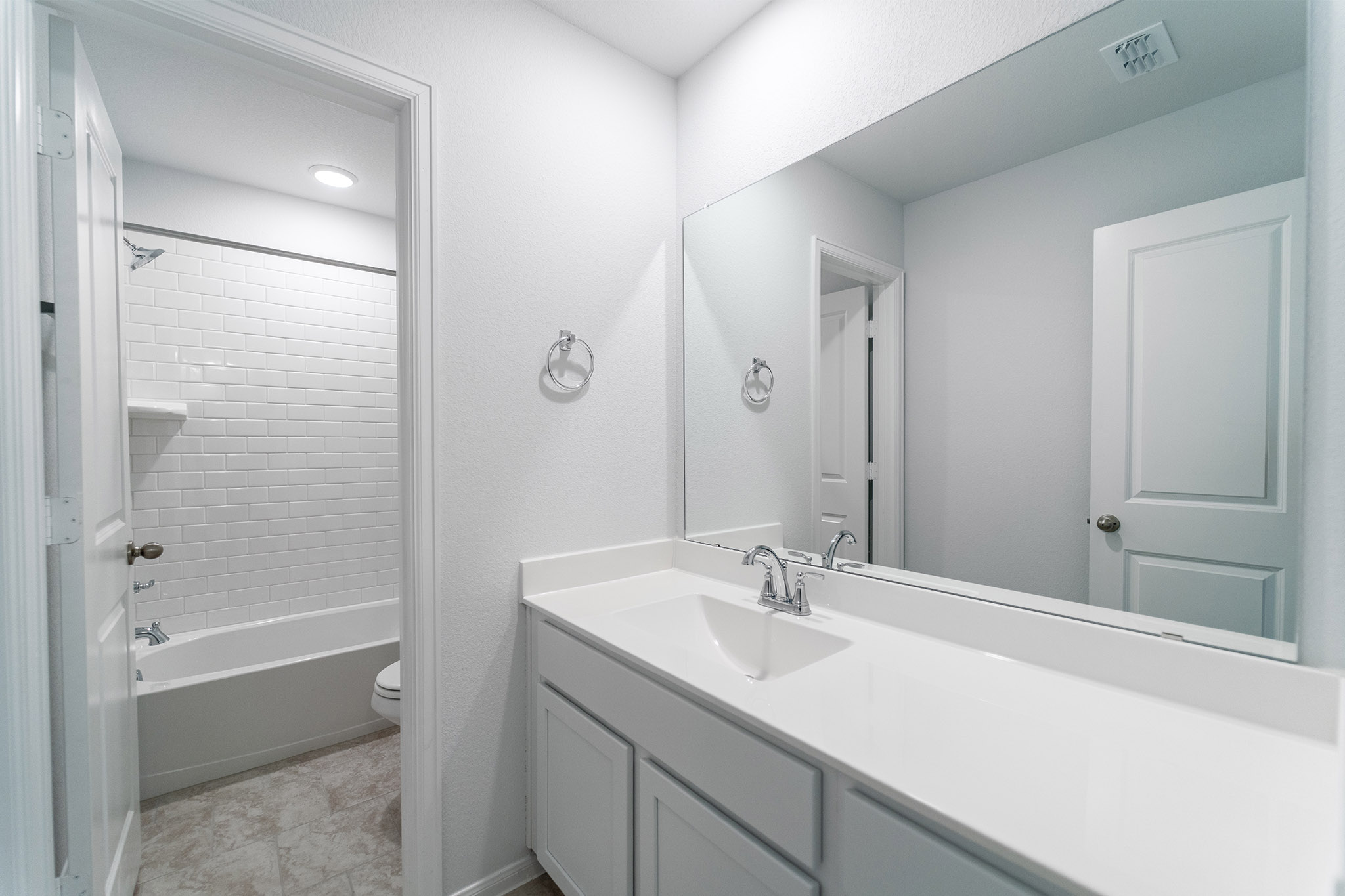 161 Mango Circle Buda, TX 78610 - Photo 13 of 22 a bathroom with a sink and a mirror