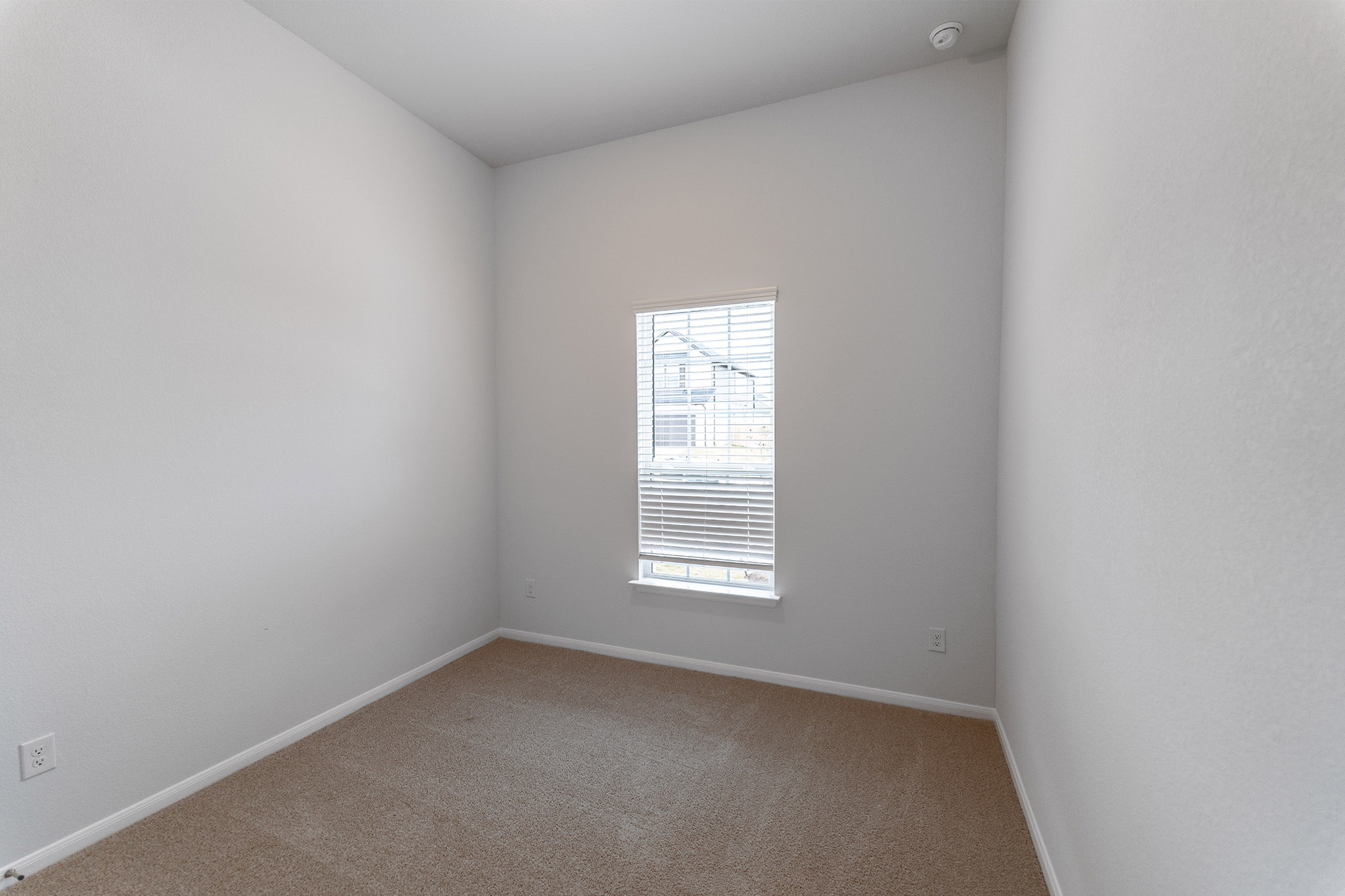 161 Mango Circle Buda, TX 78610 - Photo 16 of 22 an empty room with a window