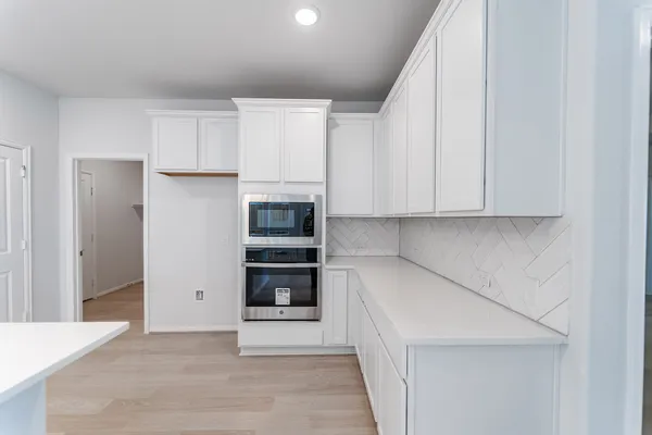 a large kitchen with stainless steel appliances kitchen island a large island in the center